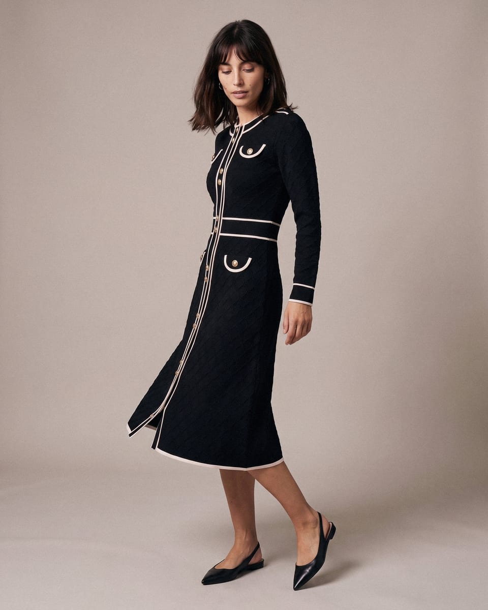 Robe passepoilée à boutons, noir, portée, demi-tour, tissu en mouvement